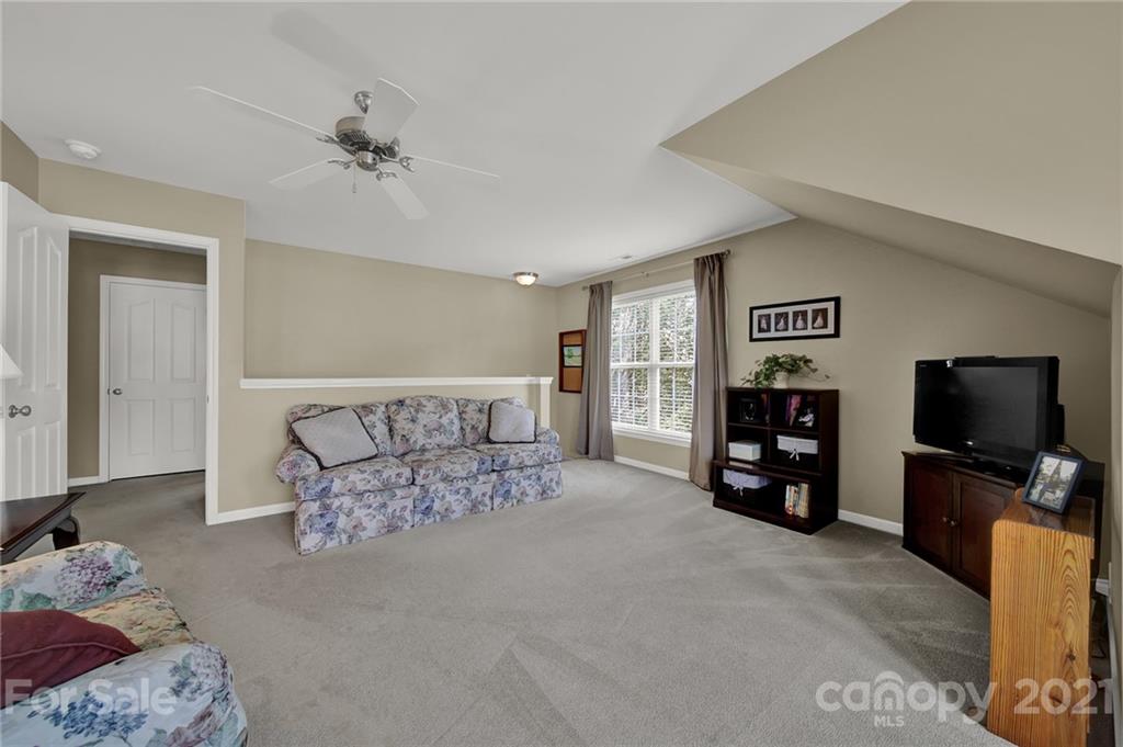 4509 Shadow Moss Circle Fort Mill, SC 29708 - Photo 29 of 43 a living room with furniture and a flat screen tv