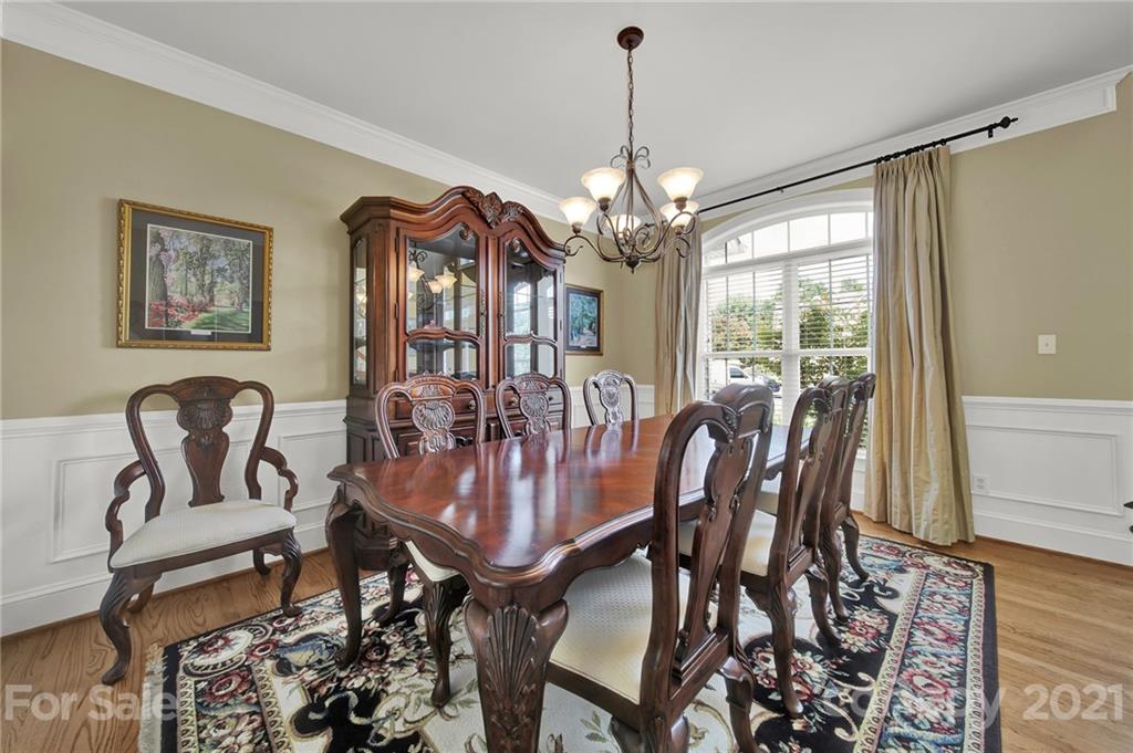 4509 Shadow Moss Circle Fort Mill, SC 29708 - Photo 4 of 43 a view of a dining room with furniture window and wooden floor