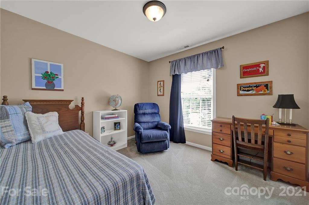 4509 Shadow Moss Circle Fort Mill, SC 29708 - Photo 31 of 43 a bedroom with a bed and furniture