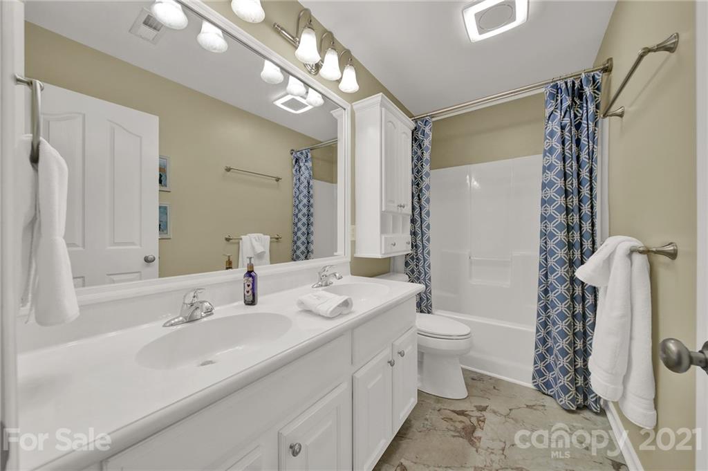 4509 Shadow Moss Circle Fort Mill, SC 29708 - Photo 33 of 43 a bathroom with a double vanity sink mirror and toilet