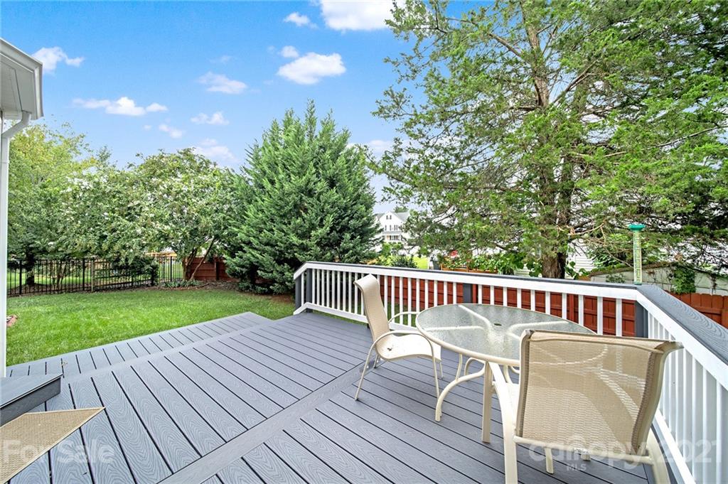 4509 Shadow Moss Circle Fort Mill, SC 29708 - Photo 34 of 43 a view of a deck with a table and chairs with wooden floor