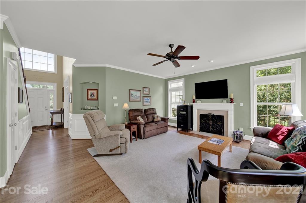 4509 Shadow Moss Circle Fort Mill, SC 29708 - Photo 6 of 43 a living room with furniture or chandelier and a fireplace