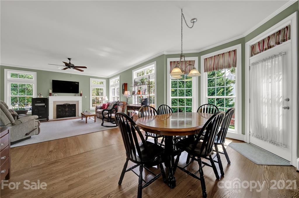 4509 Shadow Moss Circle Fort Mill, SC 29708 - Photo 8 of 43 a view of a dining room with furniture window and wooden floor