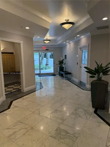 a view of a livingroom with furniture and a ceiling fan