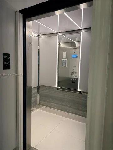 a bathroom with a shower and a glass door