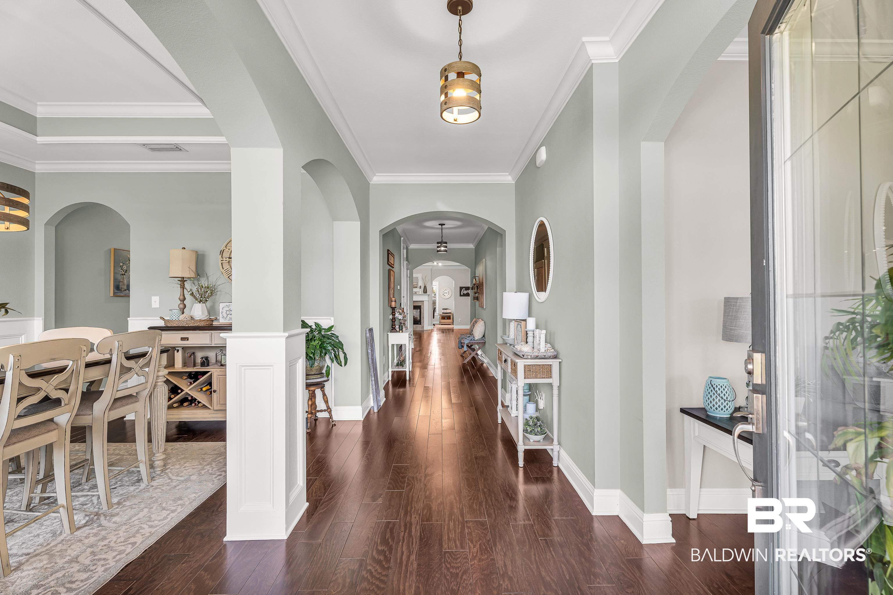 9675 Camberwell Drive Daphne, AL 36526 - Photo 2 of 34 Foyer entrance featuring wood finished floors, arched walkways, and crown molding
