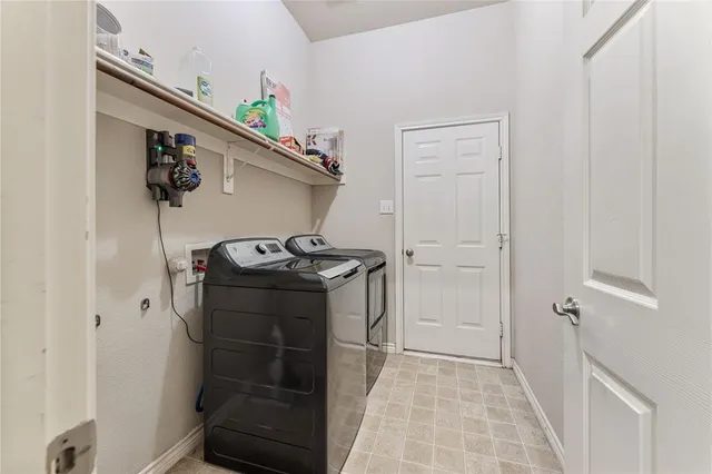 a view of hallway with washer and dryer