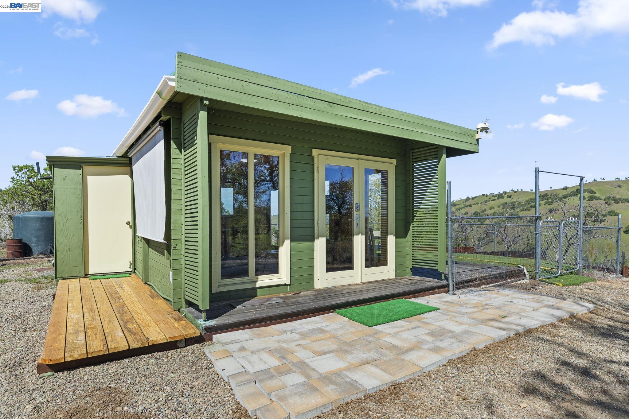 a view of backyard with large tree