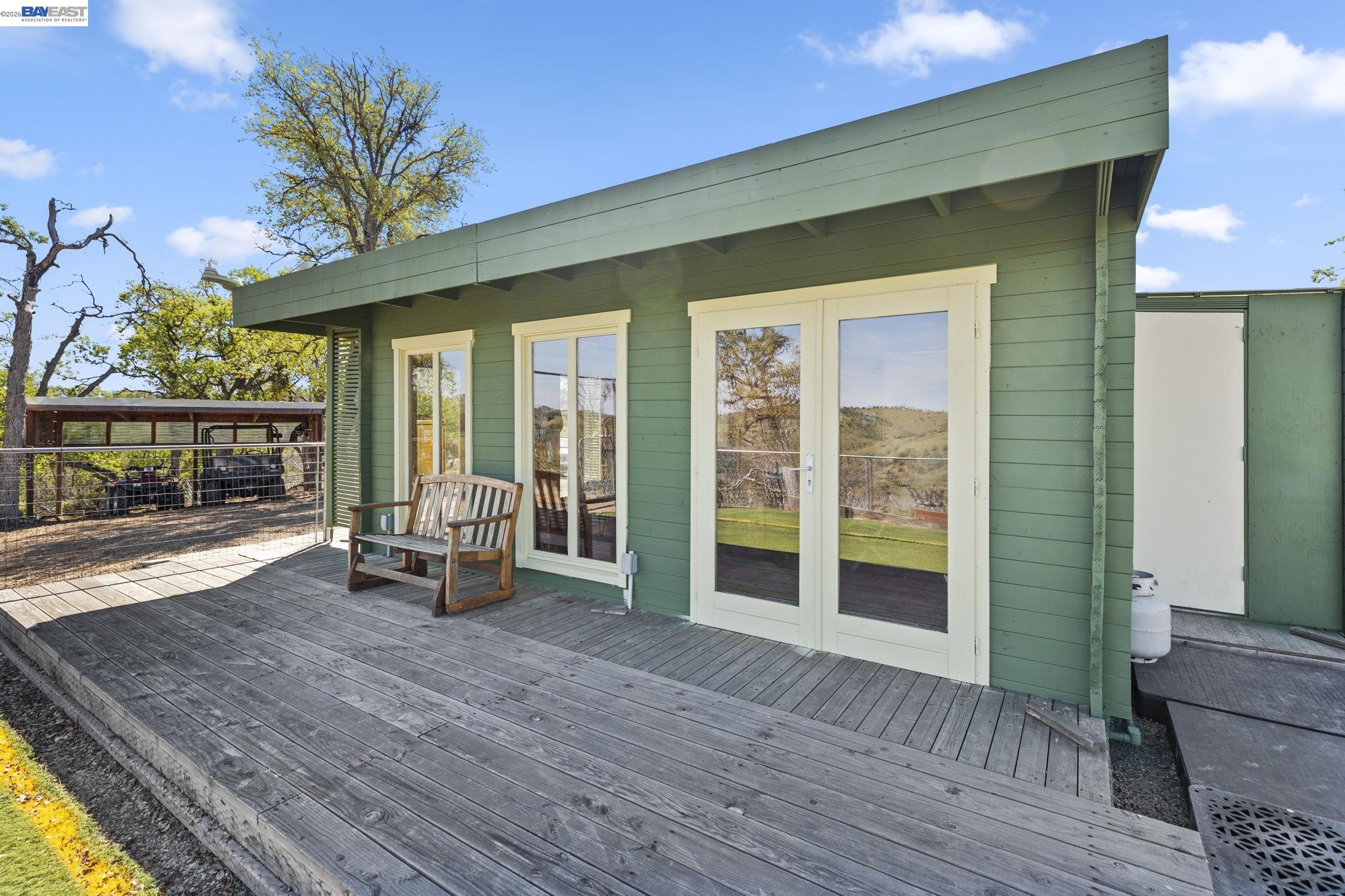 18188 West Corral Hollow Road Tracy, CA 95377 - Photo 20 of 58 a view of a room with wooden floor and outdoor space