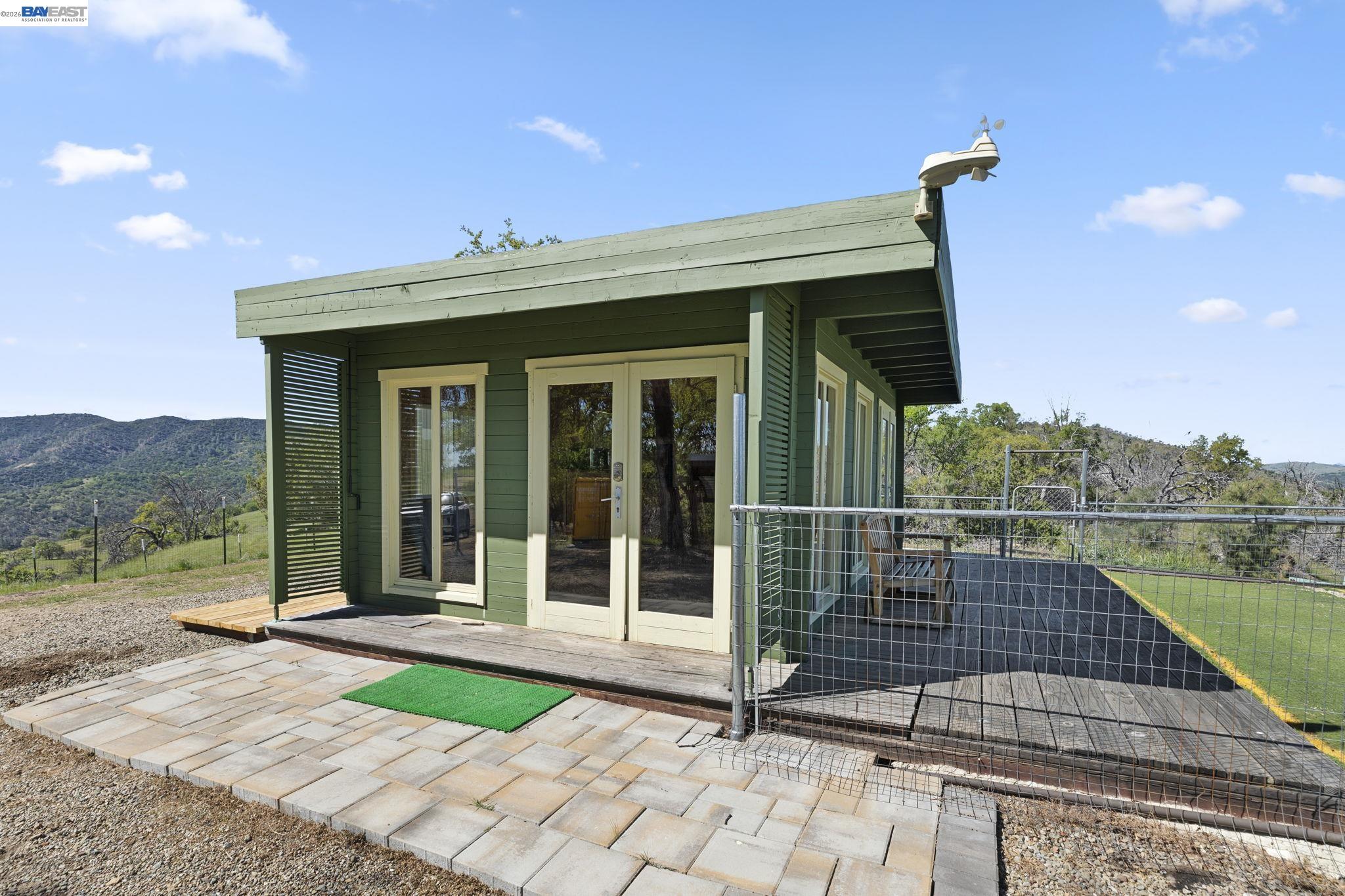 18188 West Corral Hollow Road Tracy, CA 95377 - Photo 3 of 58 a view of a balcony with wooden floor and a floor to ceiling window