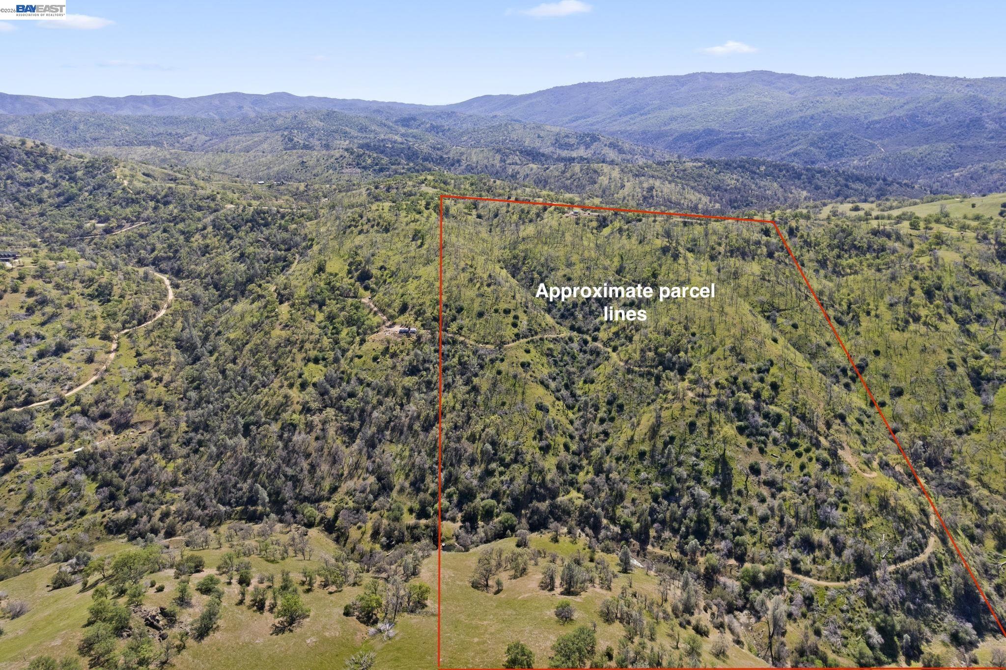 18188 West Corral Hollow Road Tracy, CA 95377 - Photo 33 of 58 a view of a lush green field with mountains in the background