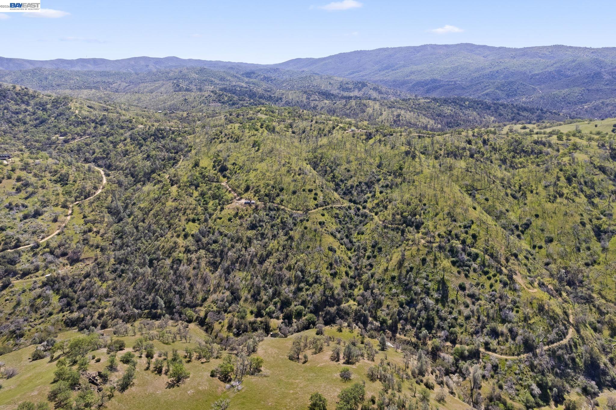 18188 West Corral Hollow Road Tracy, CA 95377 - Photo 34 of 58 a view of a lush green field with mountains in the background