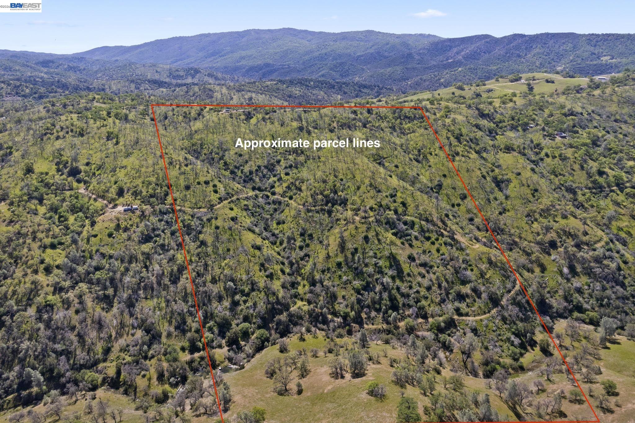 18188 West Corral Hollow Road Tracy, CA 95377 - Photo 39 of 58 a view of a lush green hillside and a building