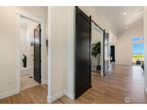 a view of hallway with wooden floor