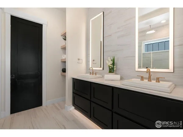 a bathroom with a double vanity sink and mirror
