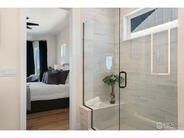 a bedroom with a bed and a potted plant