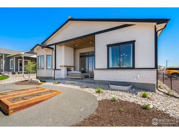 a view of a house with backyard and swimming pool