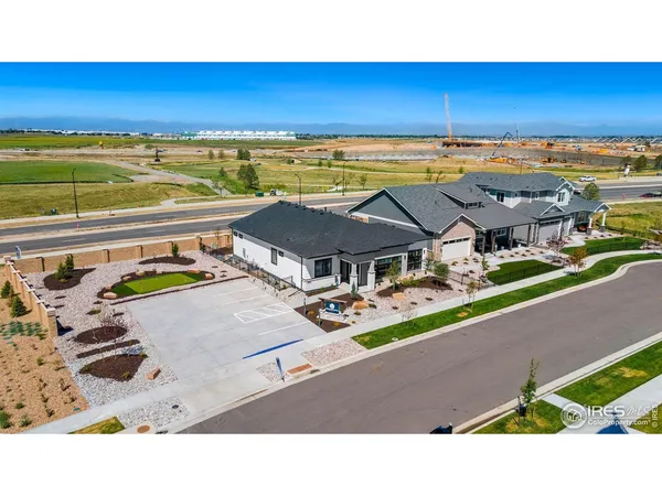 an aerial view of residential houses with city view