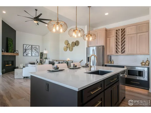 a kitchen with a sink a stove and cabinets