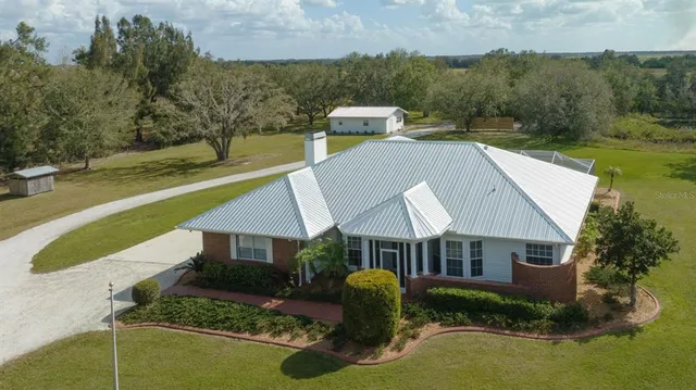 a aerial view of a house with swimming pool