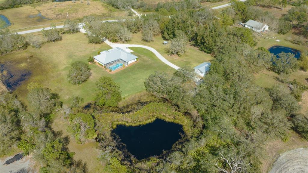 1950 Bern Creek Loop Sarasota, FL 34240 - Photo 11 of 60 a aerial view of a residential houses with yard