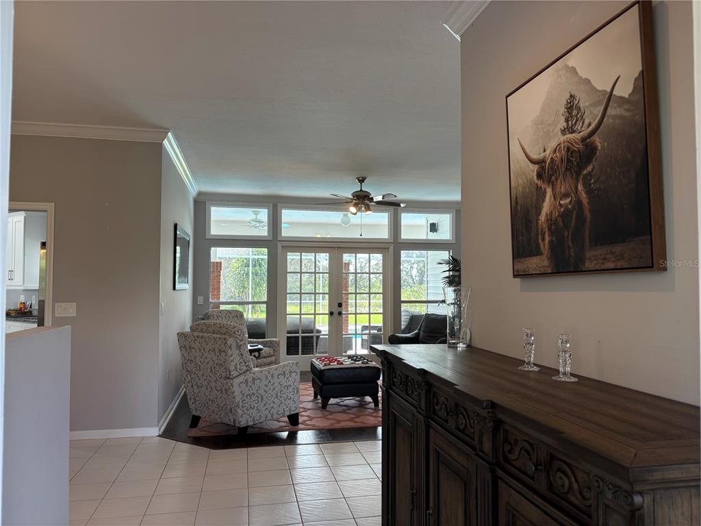 1950 Bern Creek Loop Sarasota, FL 34240 - Photo 14 of 60 a living room with large windows