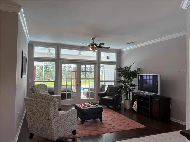 a view of a dining room with furniture and chandelier