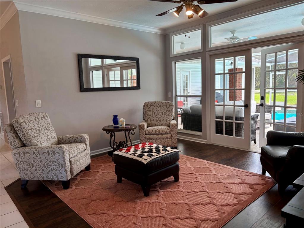 1950 Bern Creek Loop Sarasota, FL 34240 - Photo 17 of 60 a living room with furniture and a floor to ceiling window