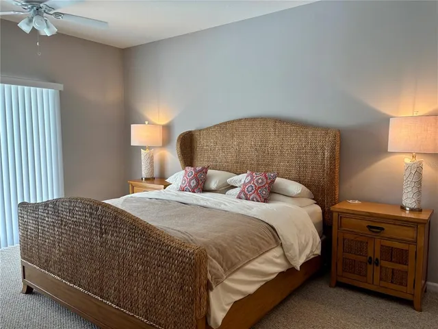 a spacious bathroom with a granite countertop sink a toilet and bathtub