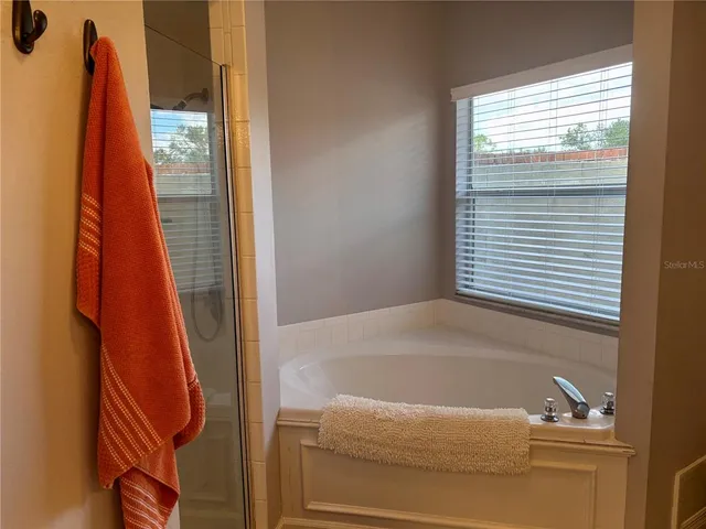 a living room with furniture a rug and a table