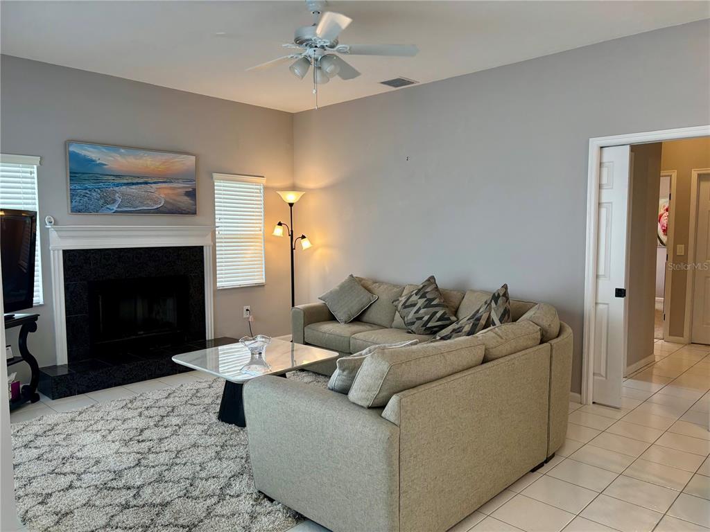 1950 Bern Creek Loop Sarasota, FL 34240 - Photo 34 of 60 a living room with furniture and a fireplace