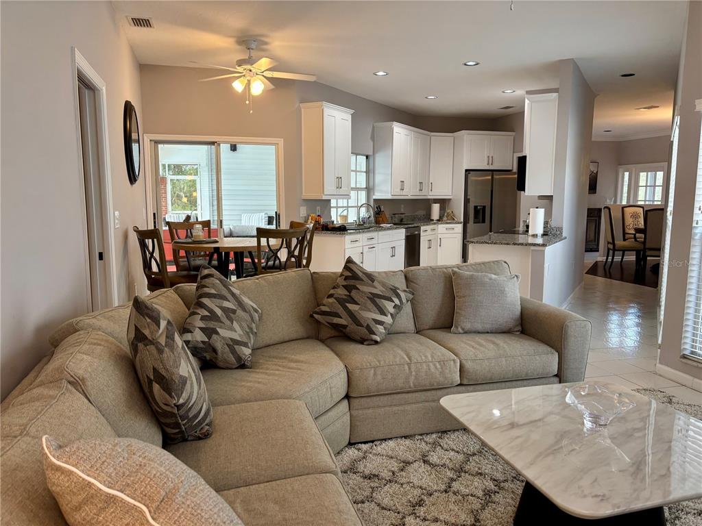 1950 Bern Creek Loop Sarasota, FL 34240 - Photo 35 of 60 a living room with furniture kitchen view and a large window