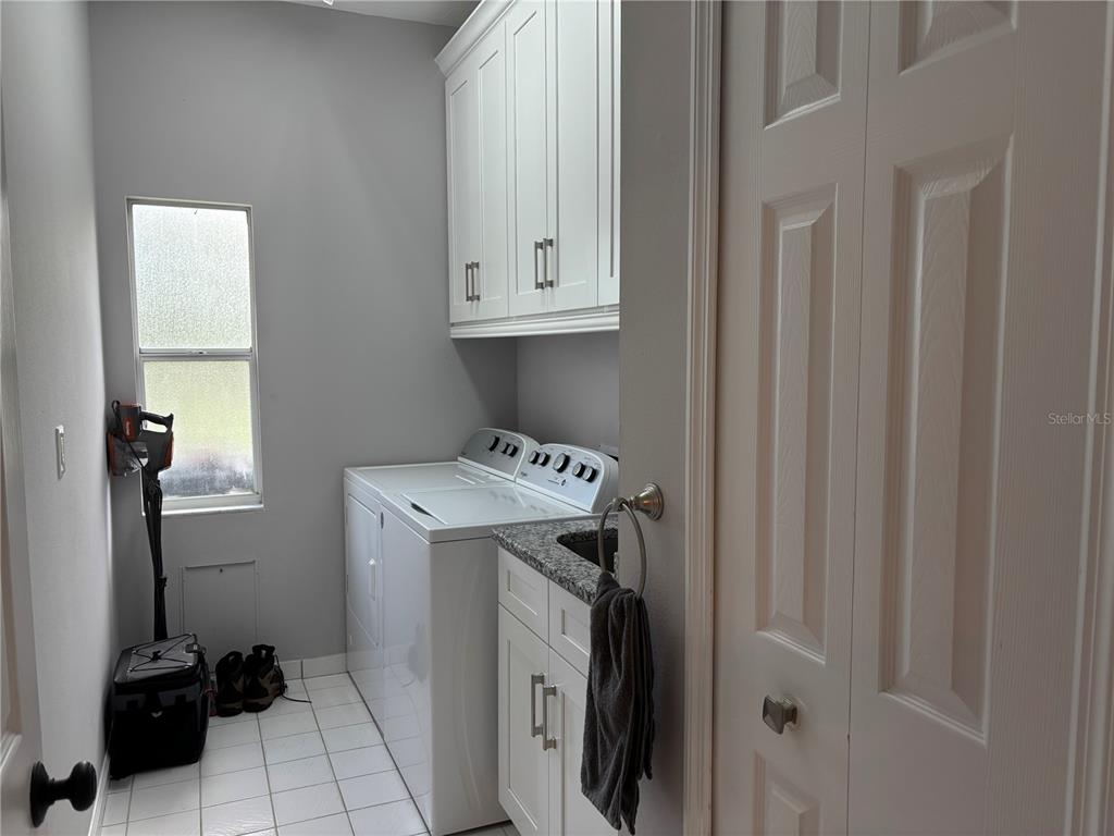 1950 Bern Creek Loop Sarasota, FL 34240 - Photo 39 of 60 a utility room with dryer and washer