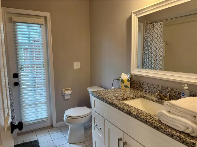 a swimming pool with outdoor seating