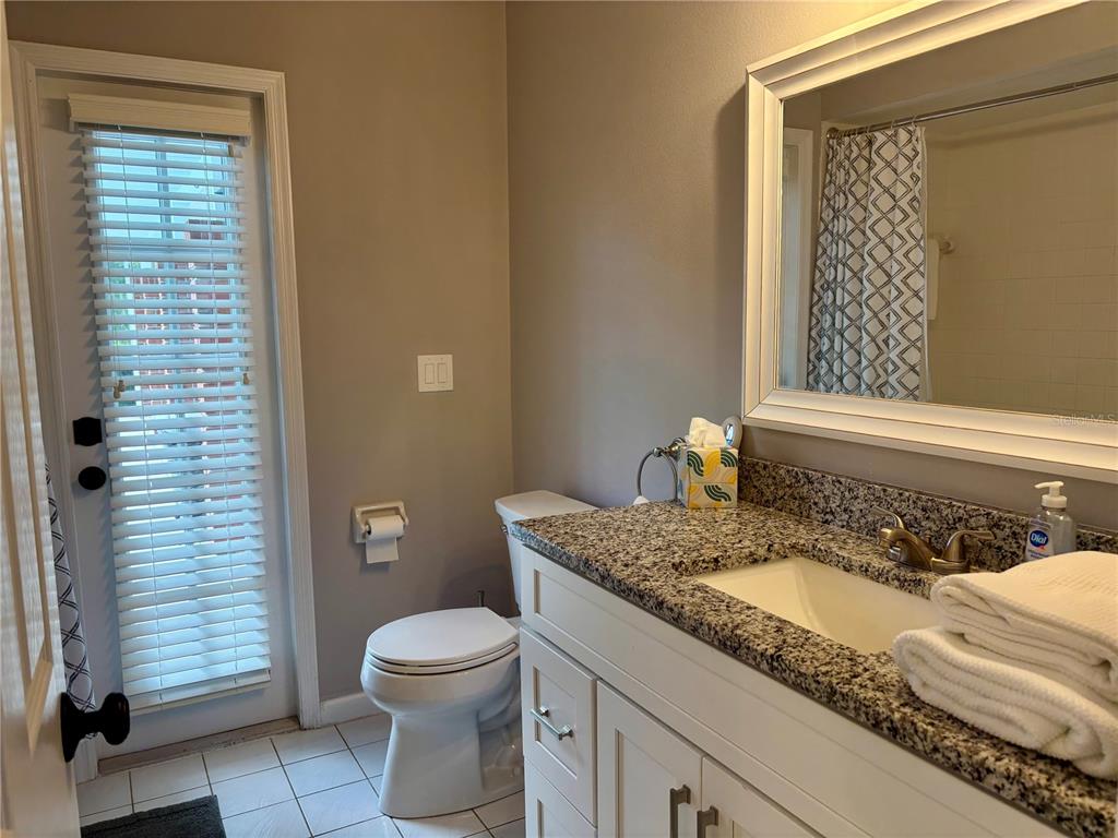 1950 Bern Creek Loop Sarasota, FL 34240 - Photo 40 of 60 a bathroom with a granite countertop sink toilet and shower