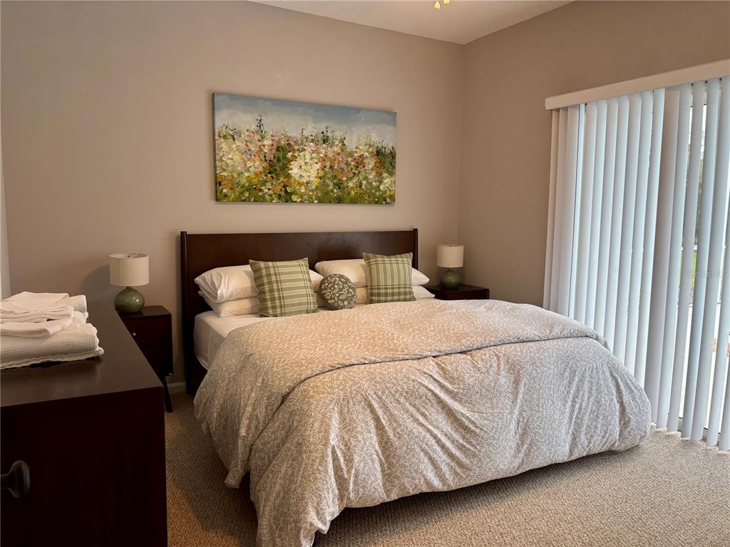 1950 Bern Creek Loop Sarasota, FL 34240 - Photo 43 of 60 a bedroom with a bed and a window
