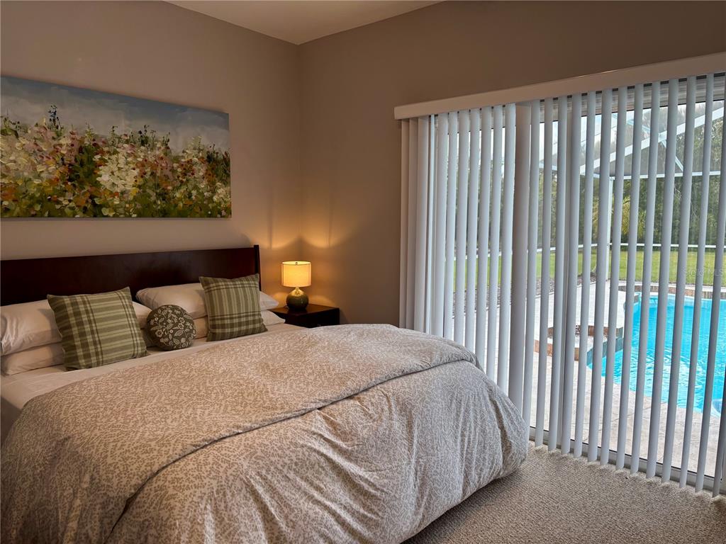 1950 Bern Creek Loop Sarasota, FL 34240 - Photo 44 of 60 a bedroom with a bed and a window