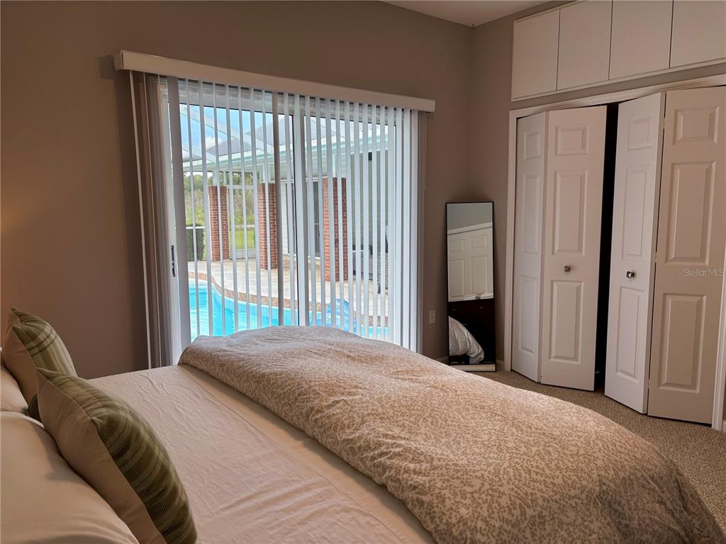 1950 Bern Creek Loop Sarasota, FL 34240 - Photo 45 of 60 a bedroom with a bed and a window