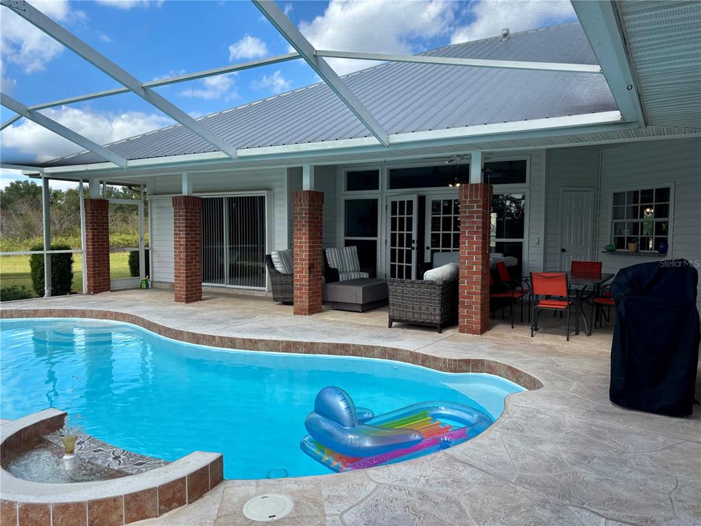 1950 Bern Creek Loop Sarasota, FL 34240 - Photo 47 of 60 a swimming pool with outdoor seating