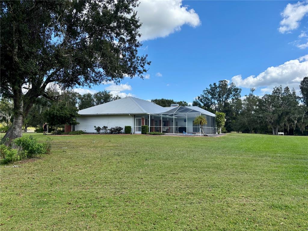 1950 Bern Creek Loop Sarasota, FL 34240 - Photo 56 of 60 a front view of a house with a garden
