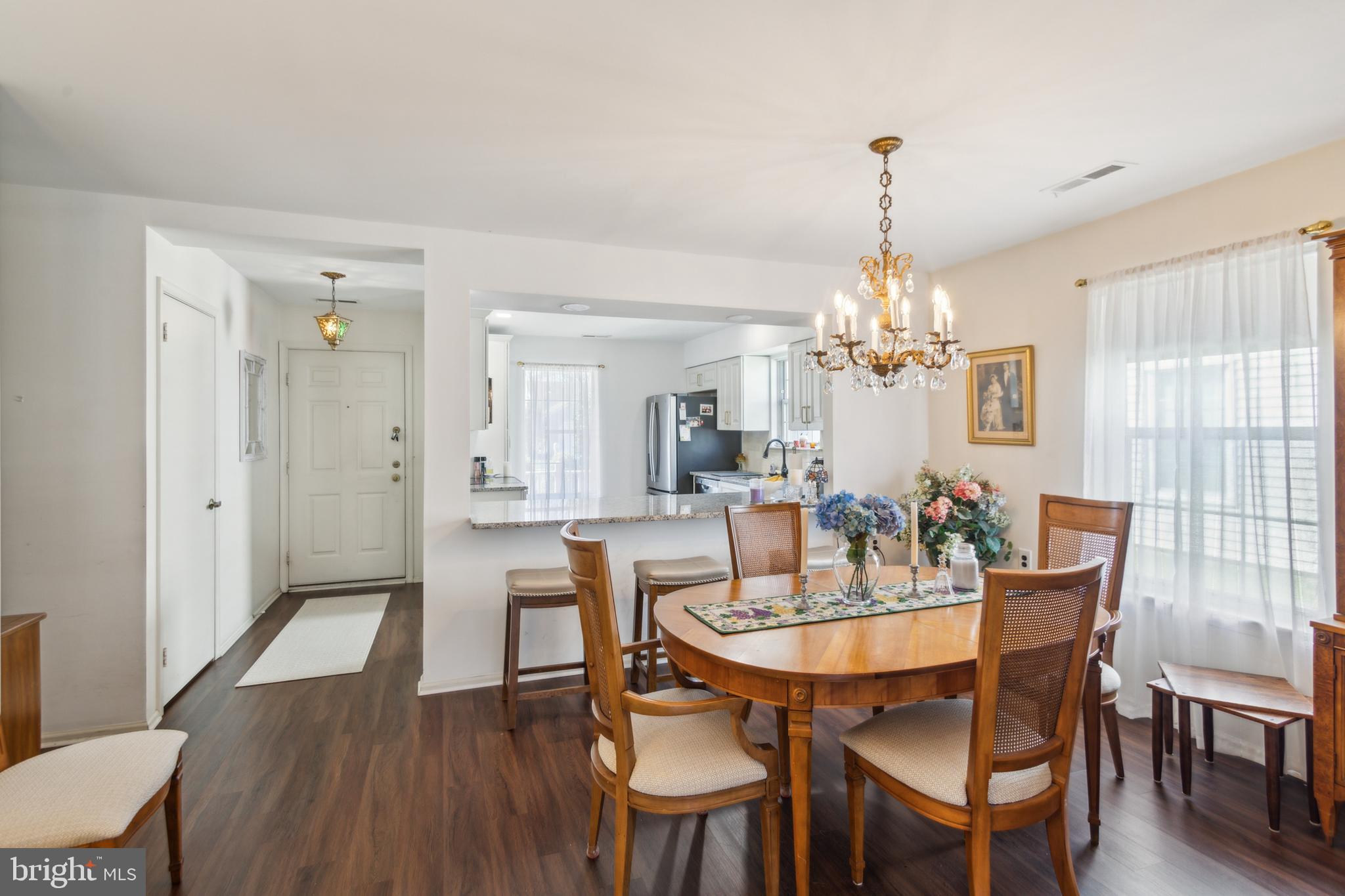 48 Eddystone Way Mount Laurel, NJ 08054 - Photo 11 of 30 a dining room with furniture a chandelier and wooden floor