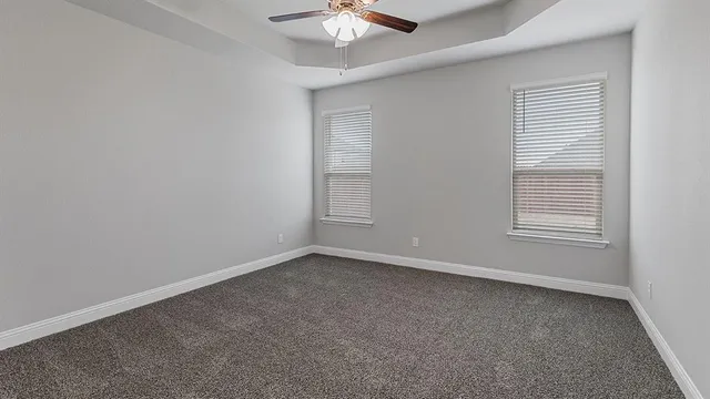 a view of a kitchen with a sink and a refrigerator