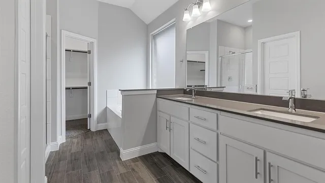 an empty room with chandelier fan