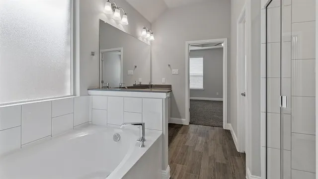 an empty room with chandelier fan