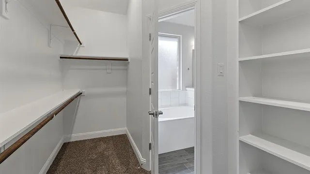 a bathroom with a double vanity sink and mirror
