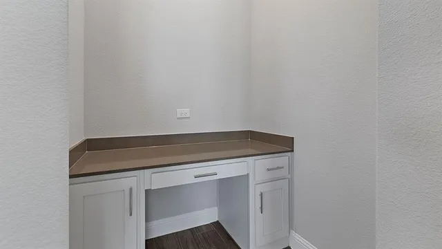 a kitchen with stainless steel appliances a refrigerator and a stove top oven