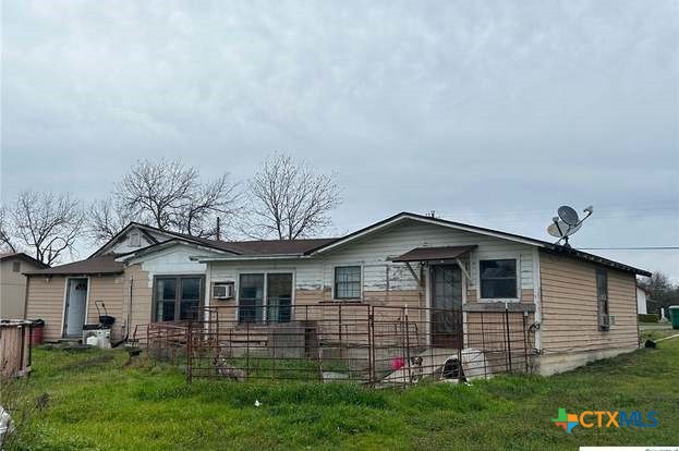 419 West Main Street Lometa, TX 76853 - Photo 15 of 16 a front view of a house with a garden