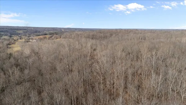 a view of a water pond with sitting area