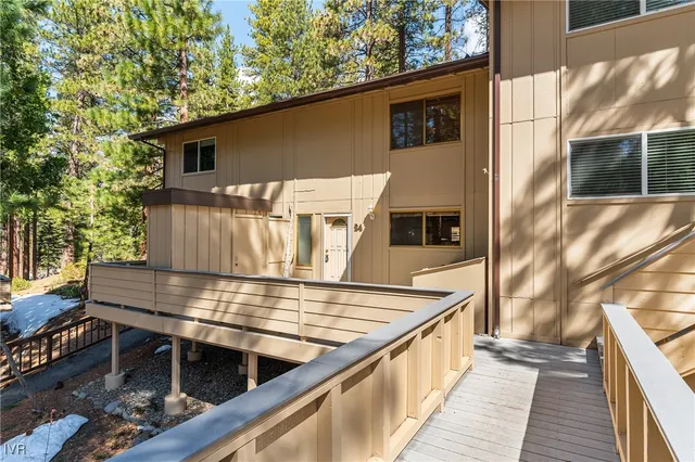 a view of outdoor with deck and outdoor kitchen