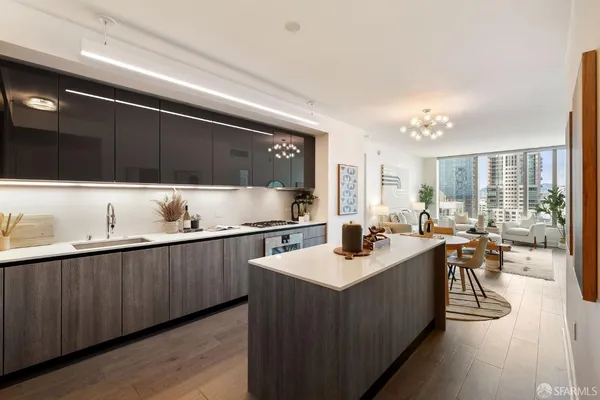a kitchen with counter top space a sink cabinets and appliances